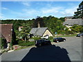 Looking from the churchyard across to a postbox