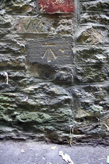 Benchmark on the Holywell face of 'The Beeches'