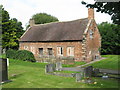 Almshouses in Acton churchyard