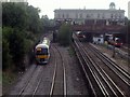 Three trains passing through Willesden Green Station