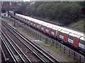 Underground train leaving Willesden Green Station