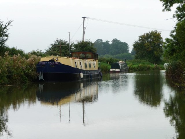 Wide-beam boat moored west of Pains Bridge [no 113]