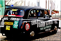 J3575 : Titanic Quarter - Taxi near Titanic Belfast covered with Signage  by Joseph Mischyshyn