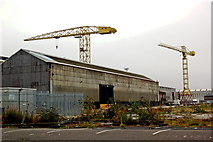 J3575 : Titanic Quarter - Building and Two Smaller Cranes beyond Two Gigantic H&B Cranes by Joseph Mischyshyn
