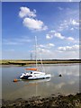 Pylons marching across Nagden Marsh from the Seawall on Faversham Creek