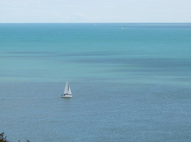 Sailing dinghy out in the bay