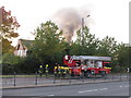 Fire in derelict building, fire engine ladder being prepared