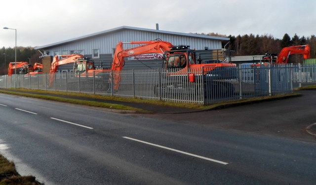 Orange machines outside Excavator House, Cinderford