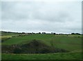 View across the incised valley of the Carey River towards farm on the Ballyvennaght Road 