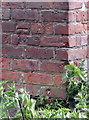 Benchmark on barn on south side of Moor Lane