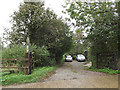 TM1344 : Footpath & entrance to Red House Cottages by Geographer