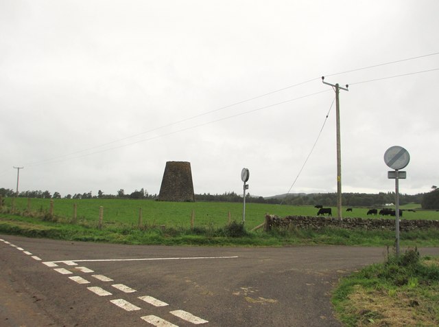 The remains of an old windmill beside a road junction