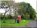 Bench and telephone box at Cumrew