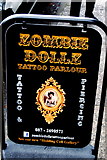 G9278 : Donegal Town - Bridge Street - Zombie Dollz Tattoo Parlour Sign by Joseph Mischyshyn