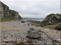 D0244 : View west along the beach at the Ballintoy Arch by Eric Jones