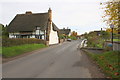 Main street where stream is culverted under the road