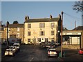 NY8355 : The Kings Head, The Golden Lion and the Co-op, Market Place by Mike Quinn