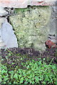 Weathered benchmark on barn conversion at Lower Farm