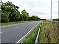 The A38 and the Dunstall Parish milepost in its setting