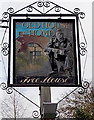 Village pub name sign in Burton