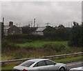 O0576 : Farmhouse and electricity sub-station at the north end of the Mary McAleese Bridge, Drogheda by Eric Jones