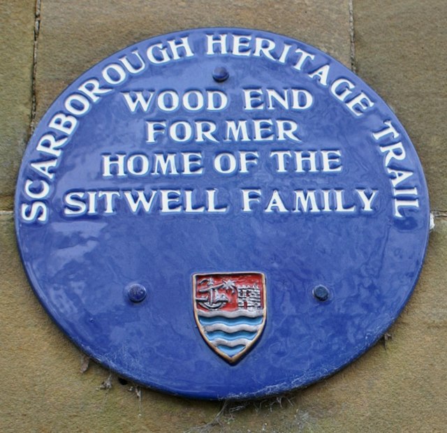 Blue plaque on the gate pillars to Wood End