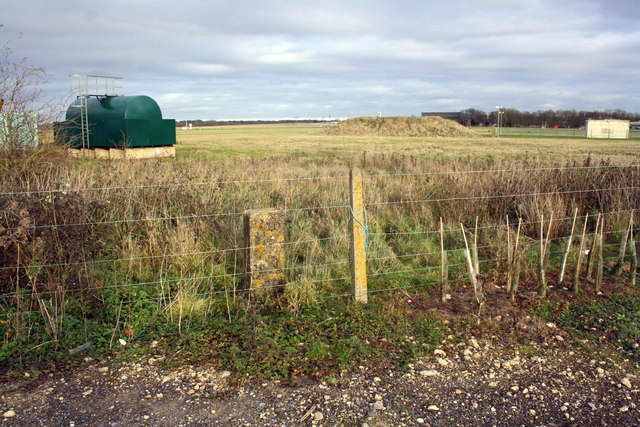 MOD boundary stone in fence, RAF Benson
