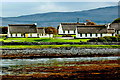 M2308 : Ballyvaghan Cottages along a bay in front of Moneen Mountain (305) by Joseph Mischyshyn