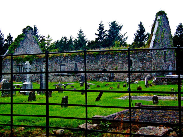 Derelict Bunratty Church & Graveyard beyond Steel Rod Fence at South End