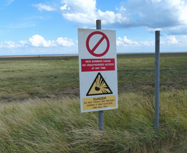 Warning sign on the sea bank
