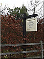 TL3360 : Knapwell Wood Farm sign by Geographer