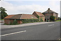 Buildings at Duncan House Farm on NE side of A168