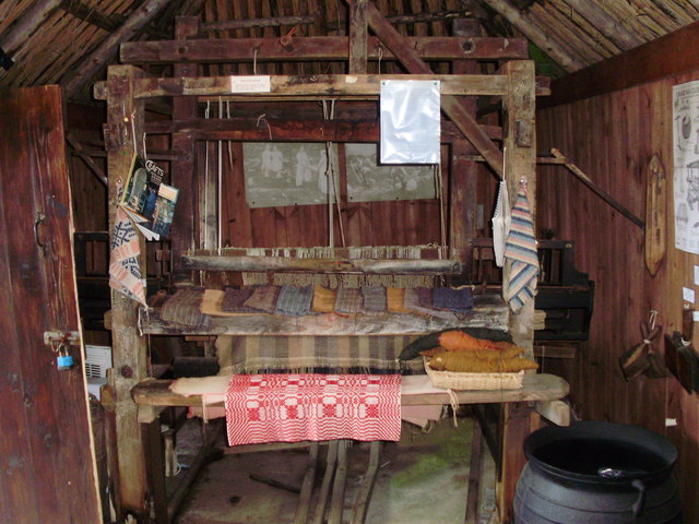 Handloom with samples of woven fabric