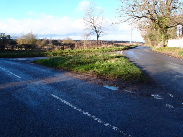Grass covered road junction near Ugley