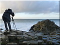 C9444 : A keen photographer, Giant's Causeway by Kenneth  Allen
