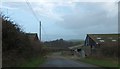 Farm buildings by the road on Knowle Hill