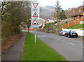 Warning signs 50 yards from traffic calming across the B4287 in Efail Fach