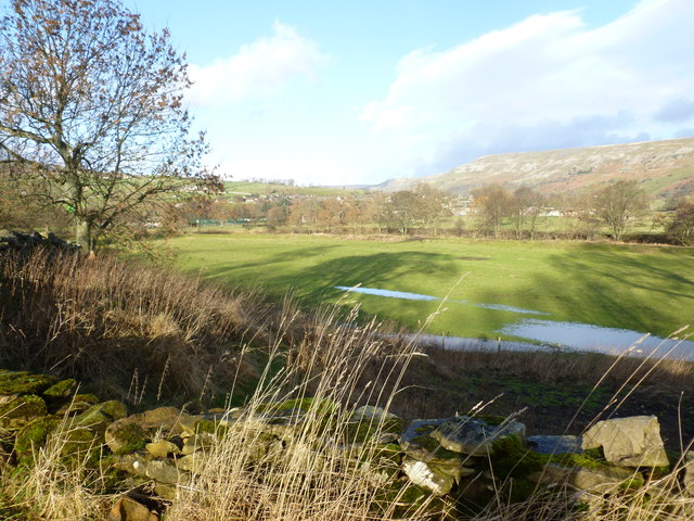 Wet fields overlooking the river Swale west of Grinton