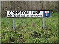 TM2637 : Grimston Lane sign by Geographer