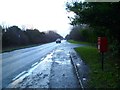 Bus stop with post box on A31