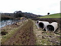 Track past three large-bore pipes, Harts Barn, Longhope