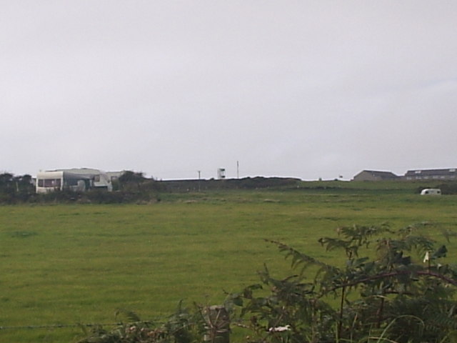 Rhosneigr - Ty Hen view of the fire station tower from the road in between the hill and park