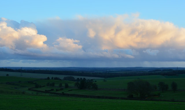 Gallops and fences, clouds and rain on Cannon Heath Down, near Kingsclere, Hampshire