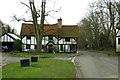 Dean Lane passes a timbered framed house