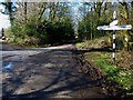 Signpost at road junction by Broadhanger Farm seen from the east