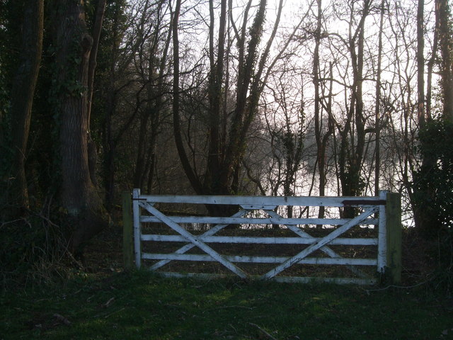 Gate and lake next to Langford Downs House