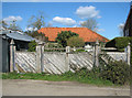 Cottage peeking over fence, St James South Elmham