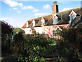 Pink cottages in The Street, St Margaret South Elmham