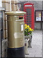 Sherborne: gold postbox, red phone box