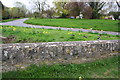 View towards Berrick Road over parapet of stream bridge